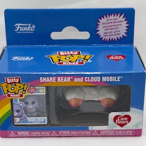 May include: A Funko Bitty Pop! Rides box featuring Share Bear and Cloud Mobile from Care Bears. The box is blue with a rainbow design and includes a Share Bear figure and a cloud-shaped vehicle. The text "Bitty Pop! Rides" is visible.