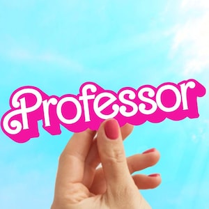 May include: A hand holds up a pink sign with the word "Professor" written in white letters.