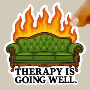 May include: A sticker featuring a green tufted sofa engulfed in flames. The sofa has a dark brown wooden frame. Above the sofa are orange and yellow flames. The text "THERAPY IS GOING WELL." is below the sofa.