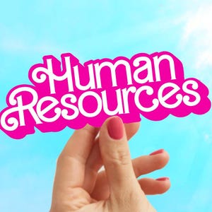 May include: A hand holds up a pink sign with the words "Human Resources" in white letters against a blue sky.