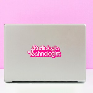 May include: A silver laptop with a pink sticker that says "Radiologic Technologist" in a retro font.