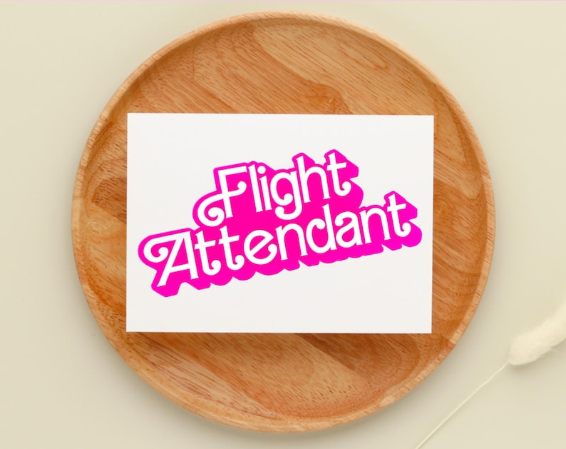 May include: A white card with the words "Flight Attendant" in pink, retro-style lettering.