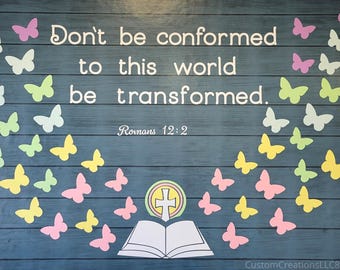 May include: A blue wooden background with white text that reads "Don't be conformed to this world be transformed." The image includes colorful paper butterflies and an open book with a cross.