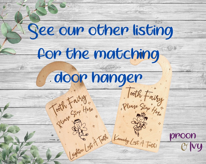 May include: Two wooden tooth fairy door hangers with a cartoon tooth fairy and the text "Tooth Fairy Please Stop Here". The hangers are personalized with the names "Leighton" and "Kennedy" and the text "Lost A Tooth!"