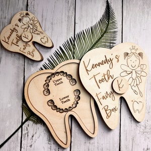 May include: Wooden tooth fairy box with a tooth-shaped lid and a fairy design. The box is personalized with the name "Kennedy's Tooth Fairy Box" and has a small compartment for a lost tooth.