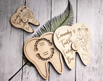 May include: Wooden tooth fairy box with a tooth-shaped lid and a fairy design. The box is personalized with the name "Kennedy's Tooth Fairy Box" and has a small compartment for a lost tooth.
