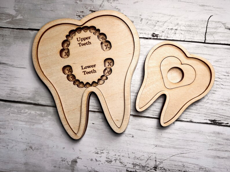 May include: Two wooden teeth models, one with a heart cutout and the other with outlines of teeth labeled "Upper Teeth" and "Lower Teeth".