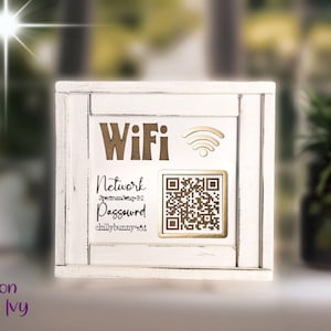 May include: A white wooden WiFi sign with a distressed finish. The sign features the word "WiFi" in brown letters, a WiFi symbol, and a QR code. Below, it displays the network name and password.