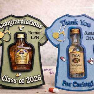 May include: Two decorative wooden shirt-shaped gifts. One is green with a Crown Royal bottle, the text "Congratulations Roman LPN Class of 2026". The other is blue with a Tito's Vodka bottle, the text "Thank You Susan CNA For Caring!"