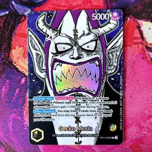 May include: A Gecko Moria trading card with a purple and white illustration of a monster with horns and sharp teeth. The card has text in English and Japanese, with a power level of 5000.
