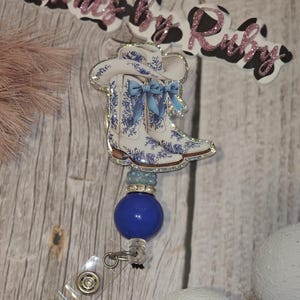 Cowgirl boots with hat badge reel/ cowgirl badge reel