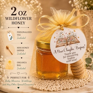 May include: A 2 oz jar of wildflower honey inside a gold organza bag with a wooden honey dipper. A round tag attached to the bag features an open book illustration with flowers and the text A New Chapter Begins! Thank you for showering Sophia with love!