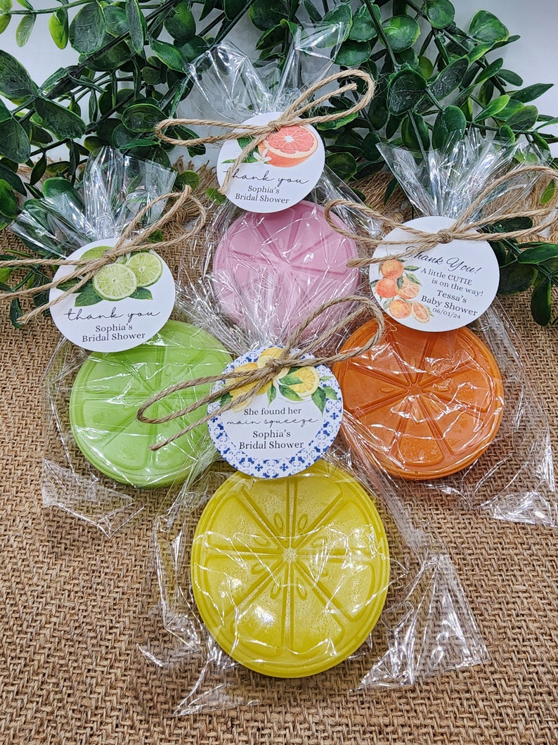 May include: Four favor boxes with citrus-themed soap and thank you tags. The tags say "Thank you, Sophia's Bridal Shower" and "Thank You! A little cutie is on the way! Tessa's Baby Shower 06/01/24".