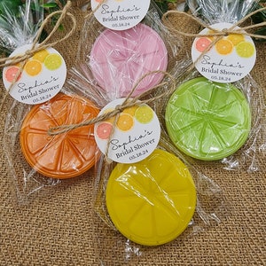 May include: Four favor boxes with citrus-themed soap and a tag that says "Sophia's Bridal Shower 05.18.24".