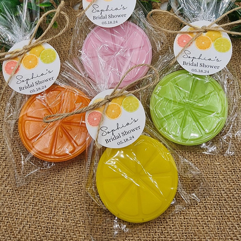 May include: Four favor boxes with citrus-themed soap and a tag that says "Sophia's Bridal Shower 05.18.24".