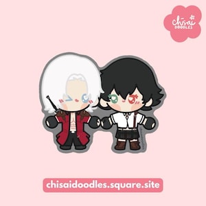 May include: A sticker featuring two chibi-style characters. The left character has white hair, a red coat, and black pants. The right character has black hair, a white shirt, and a dark skirt. The text "chisai doodles" and "chisaidoodles.square.site" appear.