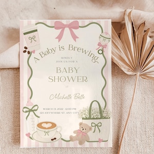 May include: A rectangular baby shower invitation card featuring a light pink and white striped background. The text reads A Baby is Brewing, Kindly Join Us For A Baby Shower of Michelle Belle, March 13, 2022, 12:00 PM, 123 Anywhere St, Any City.