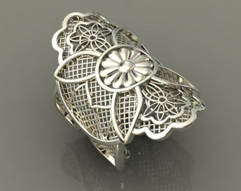 May include: A silver ring with a delicate floral design. The ring is made of a filigree pattern with a large flower in the center.