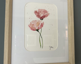 Dainty pink flower created in watercolor