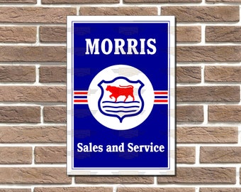May include: A blue and white sign with the text "MORRIS" in white letters. The sign features a white circle with a red bull inside and the text "Sales and Service" in white letters.