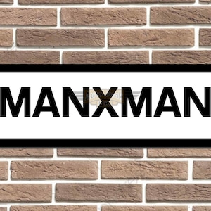 May include: Black and white sign with the text "MANXMAN" on a brick wall background.