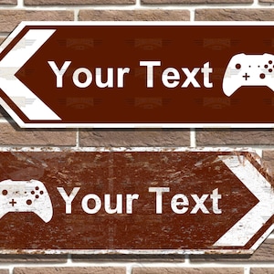 May include: Two brown and white directional signs with a white video game controller icon and the text "Your Text". The signs are on a brick wall background.