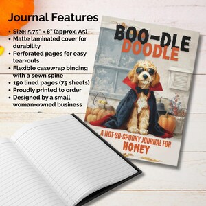 May include: A lined journal with a matte laminated cover featuring a dog dressed as a vampire with the text "BOO-DLE DOODLE". The journal is 5.75" x 8" (approx. A5) with 150 lined pages. The journal is designed by a small woman-owned business.