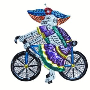 Cycling Catrina Wearing Purple Plaque
