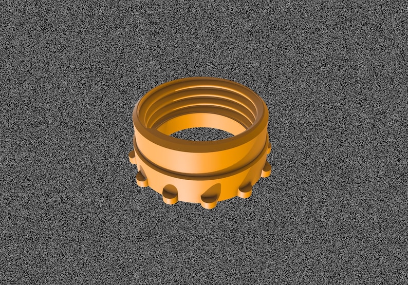 May include: A gold-colored plastic bottle cap with a ridged design. The cap has a series of small, evenly spaced teeth around the edge.