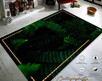May include: A green and black area rug with a fern leaf pattern. The rug has a gold border with small dots. The rug is soft and comfortable, water absorbent, and made from environmentally friendly materials. The text "Calligraphusto Ideas Design Life" is printed on the rug.
