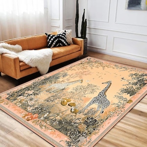 May include: A beige area rug with a floral and jungle design featuring two giraffes. The rug has a peach background with green foliage and pink flowers.