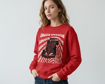 May include: A red sweatshirt with the words "Smooth Operator" in white, repeated in a diagonal pattern. The sweatshirt features a graphic of a race car in black and red.