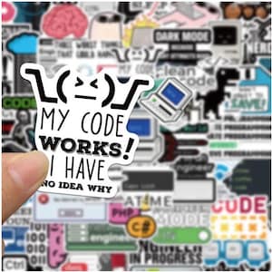 May include: A white sticker with black text that reads "MY CODE WORKS! I HAVE NO IDEA WHY". The sticker is held up against a background of other computer-related stickers. The design is humorous.