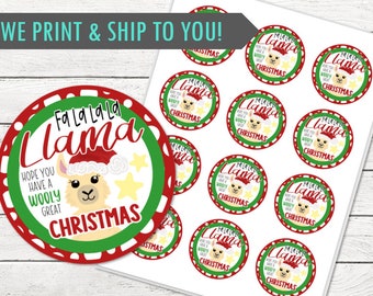 May include: Sheet of Christmas stickers featuring a llama wearing a Santa hat. The stickers have a red and green border with the text "Fa La La La Llama" and "Hope you have a wooly great Christmas". The llama has a cute expression.