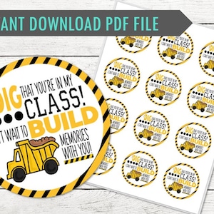 May include: A digital sheet of circular stickers featuring a yellow dump truck illustration and the text I DIG THAT YOU'RE IN MY CLASS! I CAN'T WAIT TO BUILD MEMORIES WITH YOU! The design includes a black and yellow striped border on each sticker.
