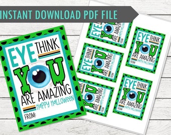 May include: A printable Halloween-themed card with the text "Eye Think You Are Amazing" and an eyeball graphic. The card has a green border with black polka dots and includes space to write "From:" at the bottom.