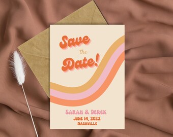 May include: Save the Date card with a retro design featuring a wavy orange, pink, and yellow stripe pattern. The text "Save the Date!" is in a bold, orange font with a 3D effect. The card also includes the names "Sarah & Derek", the date "June 14, 2023", and the location "Nashville".