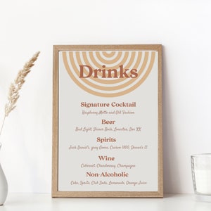 May include: A printable drinks menu with a retro design. The menu features a brown and beige colour scheme with a graphic of overlapping semi-circles. The text "Drinks" is in a bold, brown font. The menu lists signature cocktails, beer, spirits, wine, and non-alcoholic options.