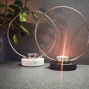 A pair of Scandinavian vintage Marble/Granite/Metal candle holders