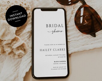 May include: A digital invitation on a smartphone screen for a bridal shower for Hailey Clarke. The invitation is set on a white fabric background with sunglasses and a seashell.