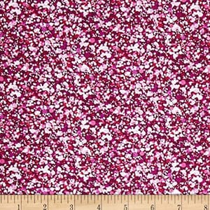 May include: A pink and white fabric with a small-scale polka dot pattern. The fabric is a blend of pink, white, and red dots on a dark pink background.