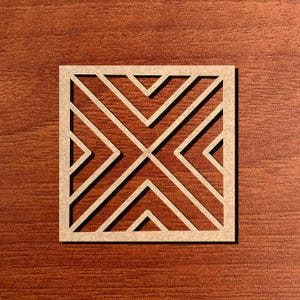 May include: A square, laser-cut wooden coaster with a geometric design. The coaster features a repeating pattern of intersecting lines and angles, creating a symmetrical design. The coaster is light brown and sits on a dark brown wooden surface.