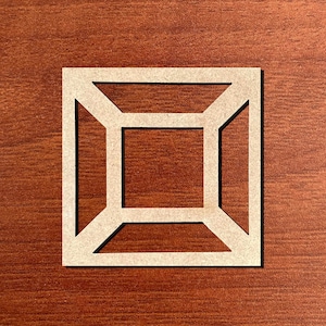 May include: A square, geometric wooden cutout with a nested square design. The cutout is light beige and sits on a dark brown wooden surface. The design features angled lines connecting the outer and inner squares.