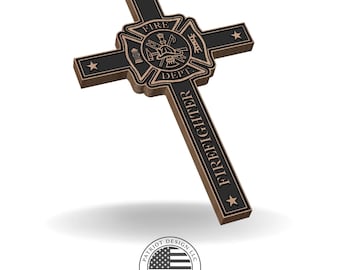 May include: Bronze-colored cross with a black center, featuring a firefighter emblem and the word "FIREFIGHTER." The cross has stars on each arm and a shadow beneath it. The bottom of the image shows a circular logo with an American flag design.