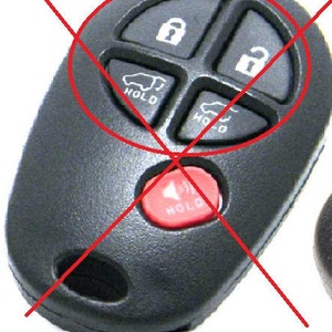 May include: Black car key fob with four buttons: lock, unlock, and two buttons with car icons and the word "HOLD". A red button with the word "HOLD" is also visible.