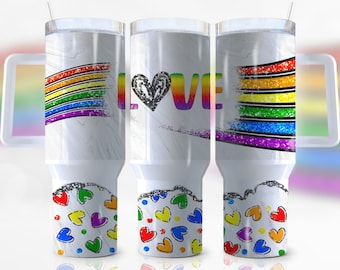 May include: Three white stainless steel tumblers with a rainbow glitter design and the word "LOVE" on the middle tumbler. The tumblers have a handle and a lid. The bottom of each tumbler has a design of colourful hearts.