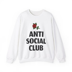 May include: White long-sleeve sweatshirt with a black graphic print of a red rose and the text "ANTI SOCIAL CLUB".