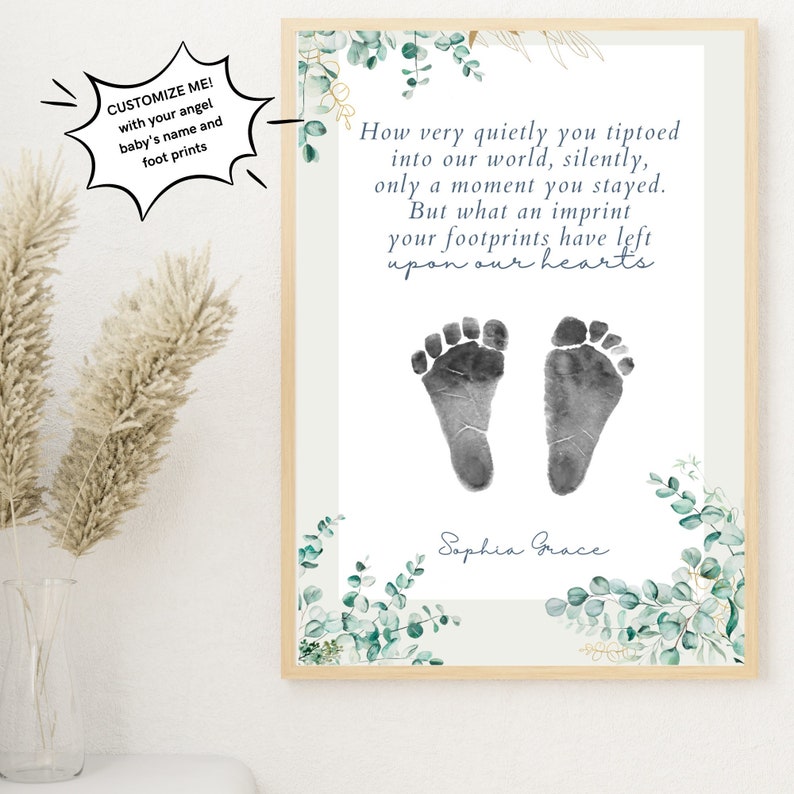 May include: A white framed print with a watercolor design of eucalyptus leaves and gold accents. The print features a poem about a baby's footprints and the text "How very quietly you tiptoed into our world, silently, only a moment you stayed. But what an imprint your footprints have left upon our hearts" and the name "Sophia Grace".