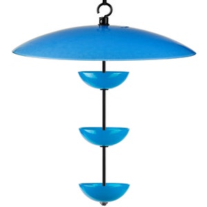 May include: A blue bird feeder with three feeding bowls and a blue canopy to protect the food from the elements.