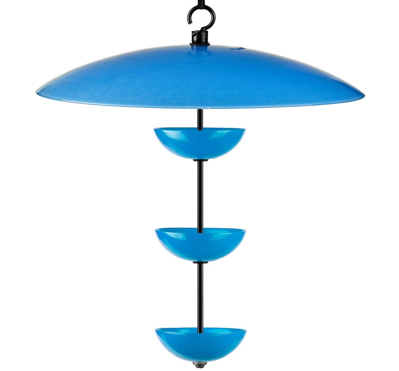 May include: A blue bird feeder with three feeding bowls and a blue canopy to protect the food from the elements.